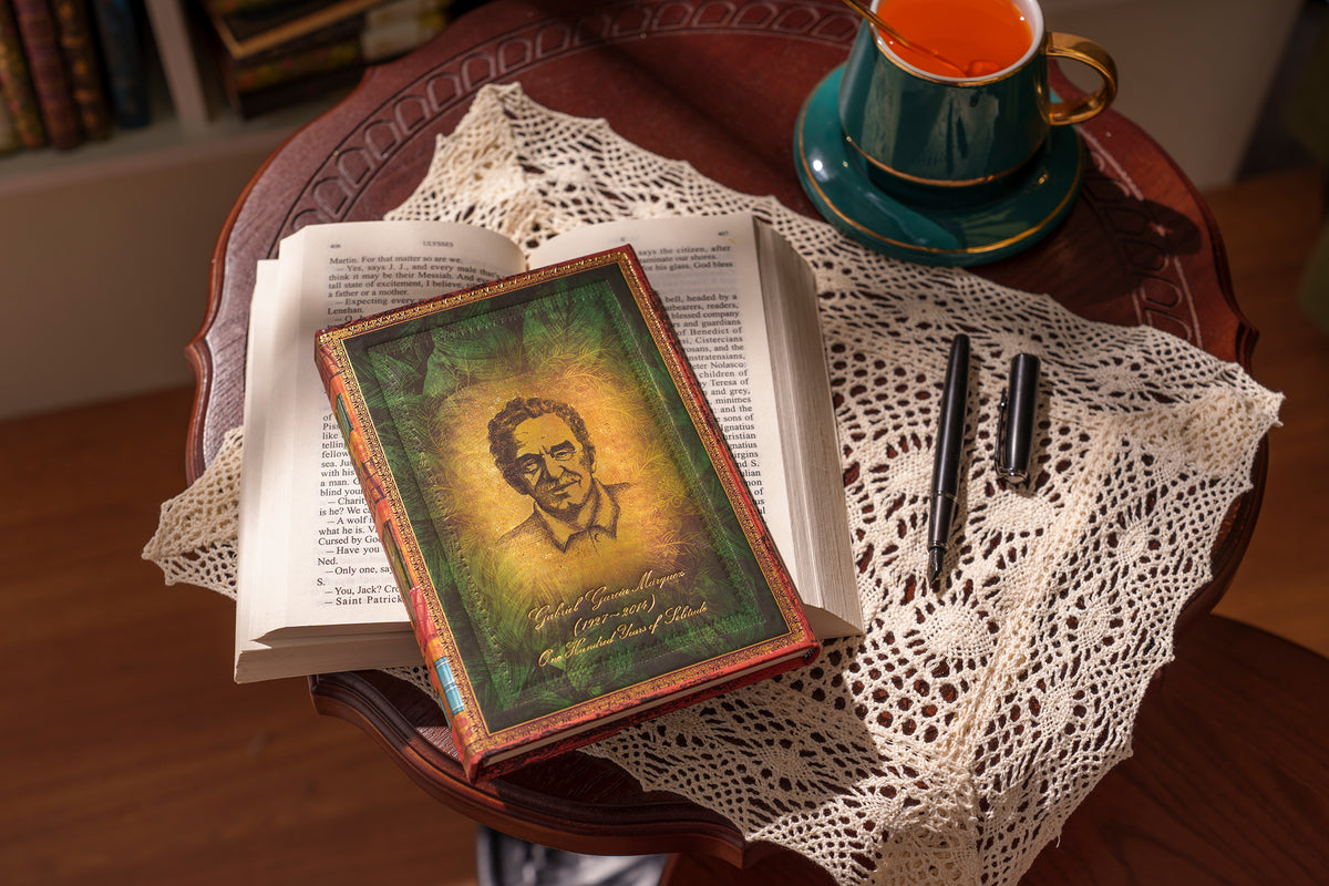 Paperblanks Garcia Marquez, One Hundred Years of Solitude Midi Hardback Journal – Plain, 144 Pages – lifestyle image