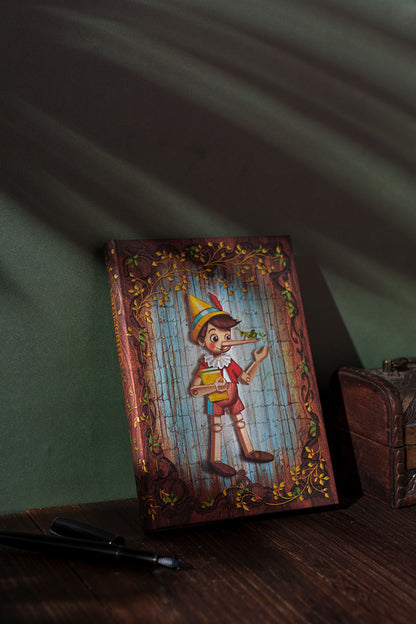 Paperblanks Carlo Collodi, Pinocchio Ultra Hardback Journal – Plain, 144 Pages – lifestyle image
