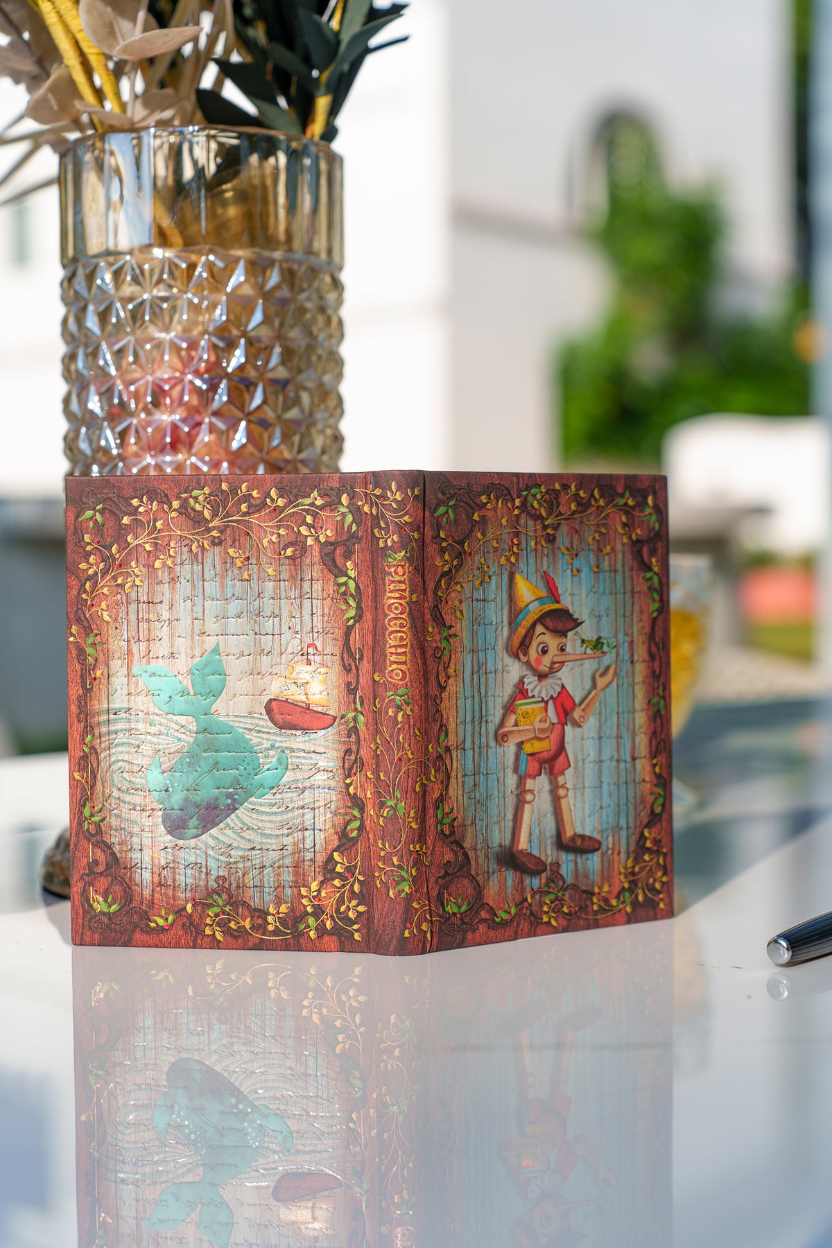Paperblanks Carlo Collodi, Pinocchio Ultra Hardback Journal – Plain, 144 Pages – lifestyle image