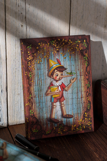 Paperblanks Carlo Collodi, Pinocchio Ultra Hardback Journal – Plain, 144 Pages – lifestyle image