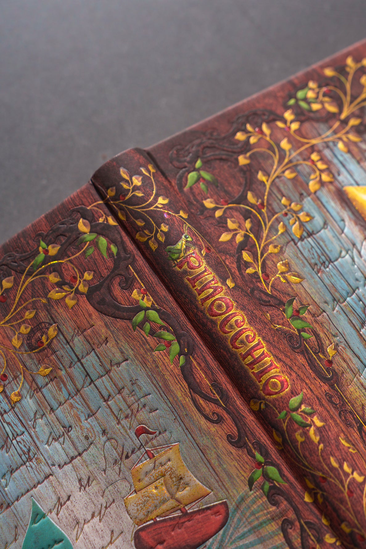 Paperblanks Carlo Collodi, Pinocchio Midi Hardback Journal – Lined, 144 Pages – lifestyle image