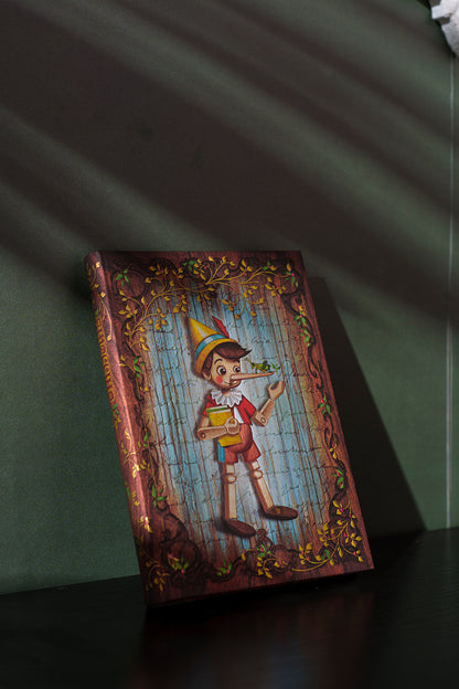 Paperblanks Carlo Collodi, Pinocchio Midi Hardback Journal – Lined, 144 Pages – lifestyle image