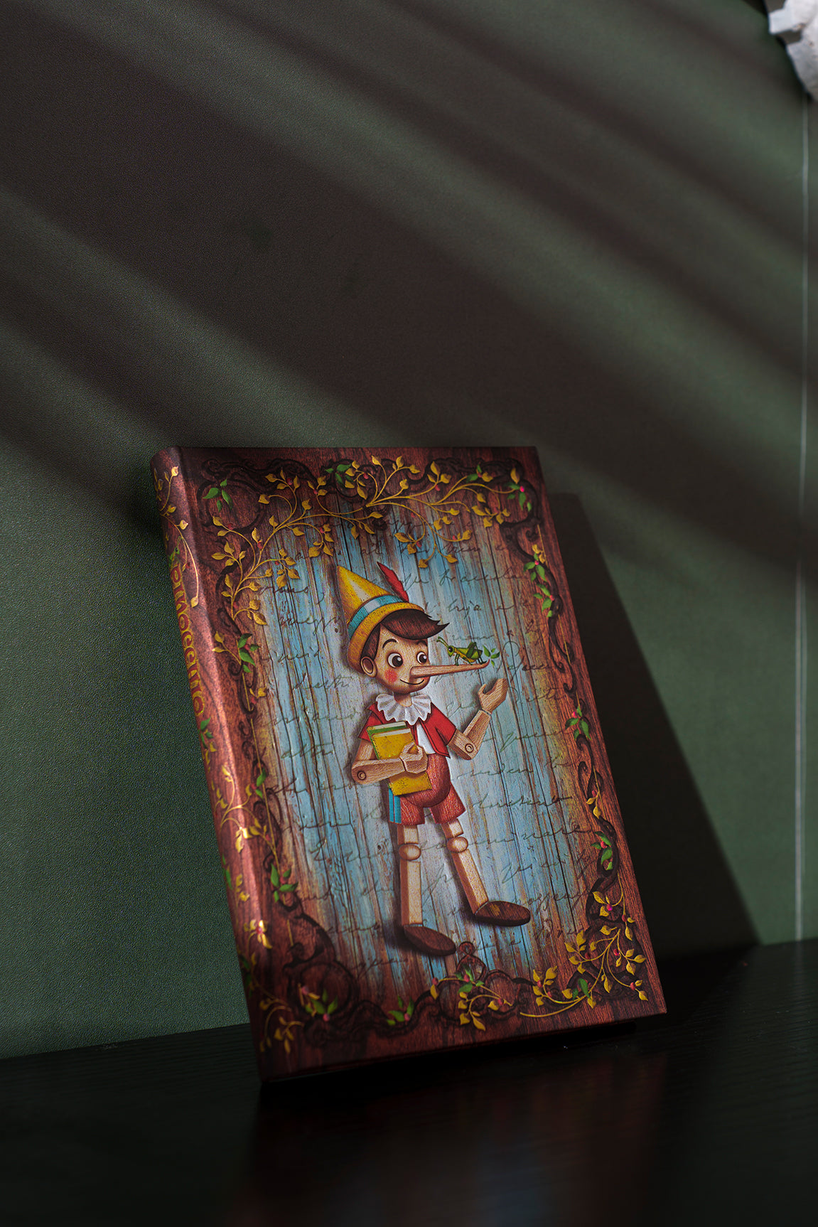 Paperblanks Carlo Collodi, Pinocchio Mini Hardback Journal – Plain, 176 Pages – lifestyle image