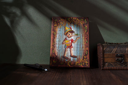 Paperblanks Carlo Collodi, Pinocchio Mini Hardback Journal – Plain, 176 Pages – lifestyle image