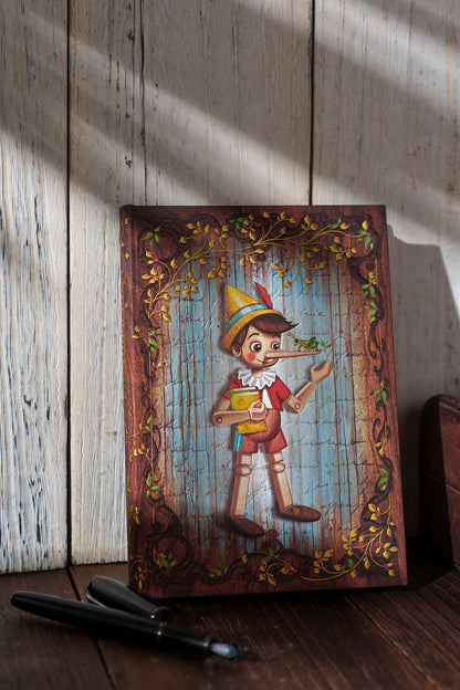 Paperblanks Carlo Collodi, Pinocchio Mini Hardback Journal – Plain, 176 Pages – lifestyle image