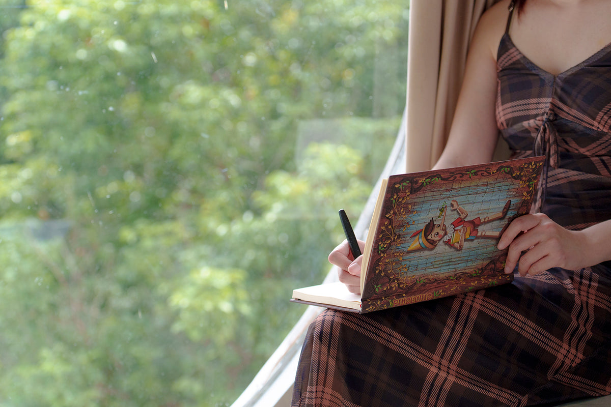 Paperblanks Carlo Collodi, Pinocchio Mini Hardback Journal – Plain, 176 Pages – lifestyle image