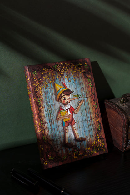 Paperblanks Carlo Collodi, Pinocchio Mini Hardback Journal – Plain, 176 Pages – lifestyle image