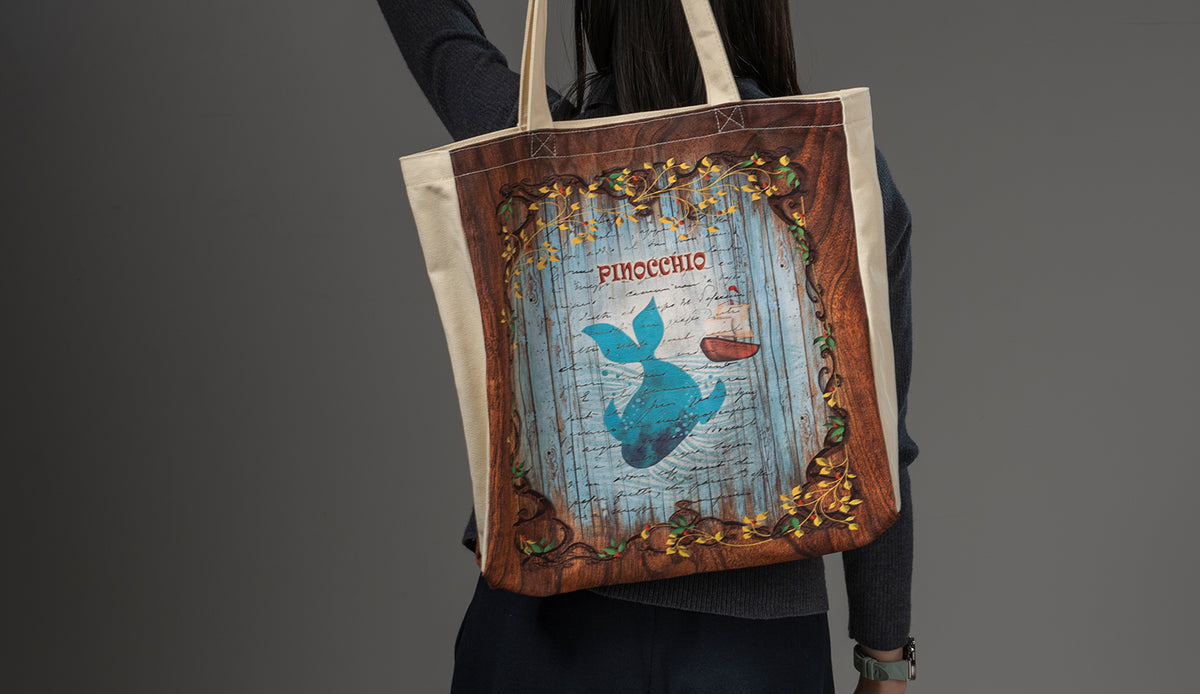 Paperblanks Carlo Collodi, Pinocchio Cotton Tote Bag – lifestyle image