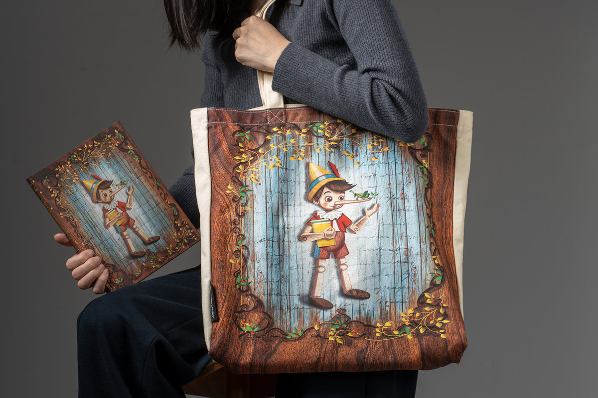 Paperblanks Carlo Collodi, Pinocchio Cotton Tote Bag – lifestyle image