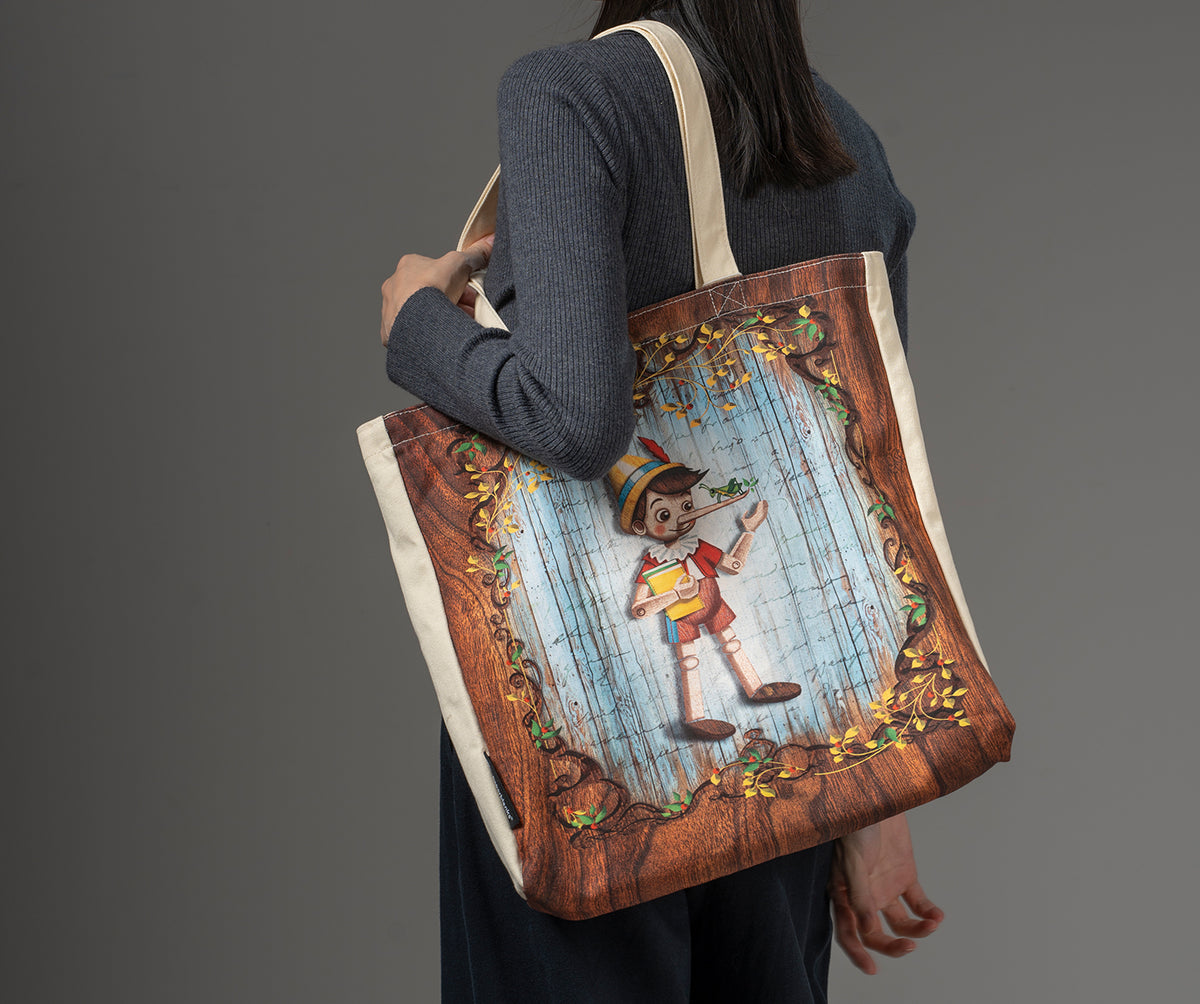 Paperblanks Carlo Collodi, Pinocchio Cotton Tote Bag – lifestyle image