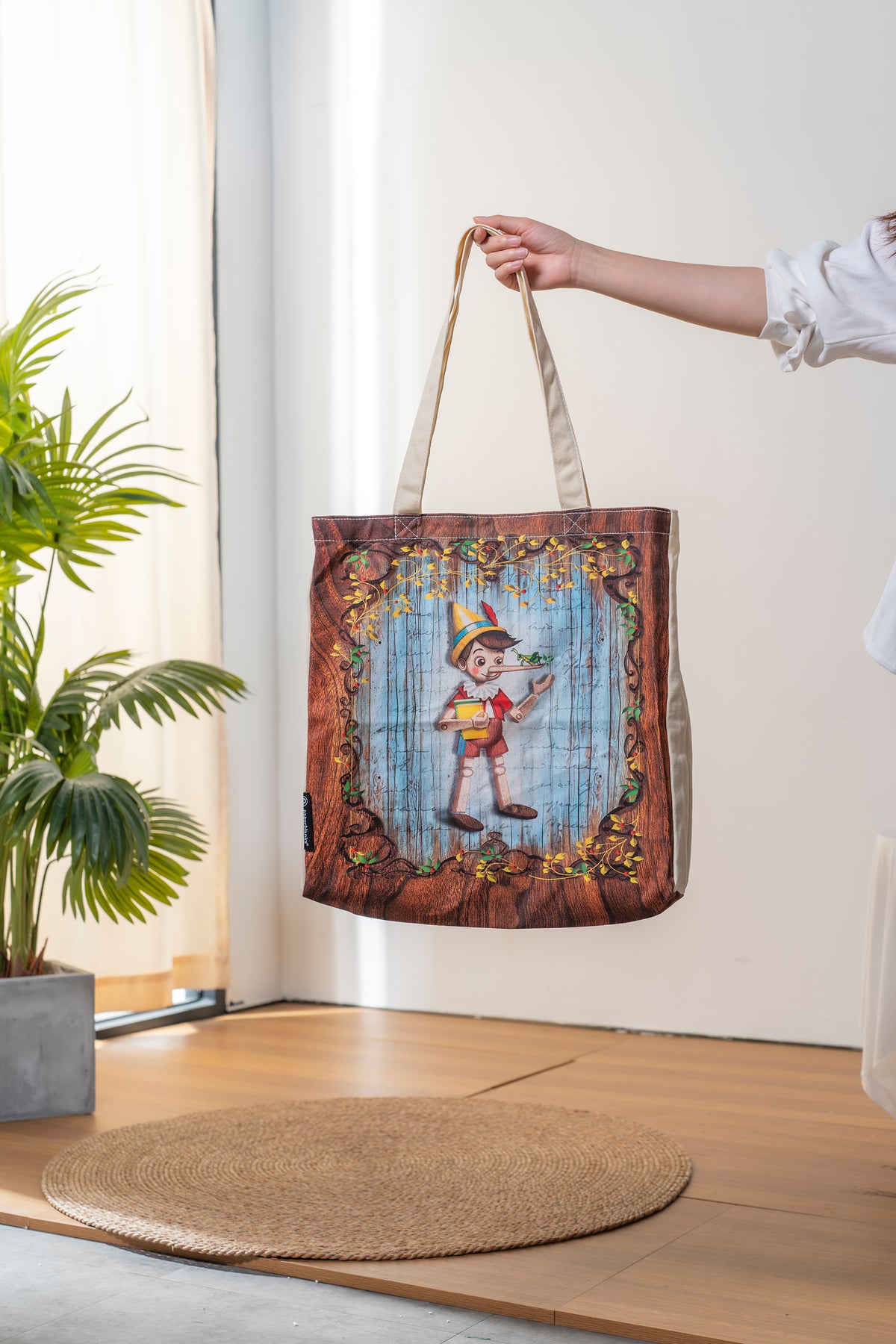Paperblanks Carlo Collodi, Pinocchio Cotton Tote Bag – lifestyle image