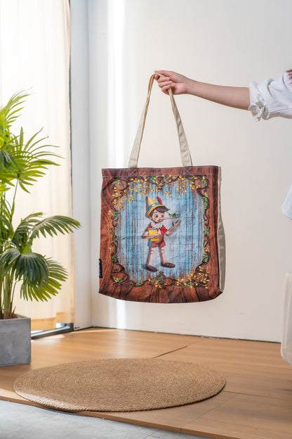 Paperblanks Carlo Collodi, Pinocchio Cotton Tote Bag – lifestyle image