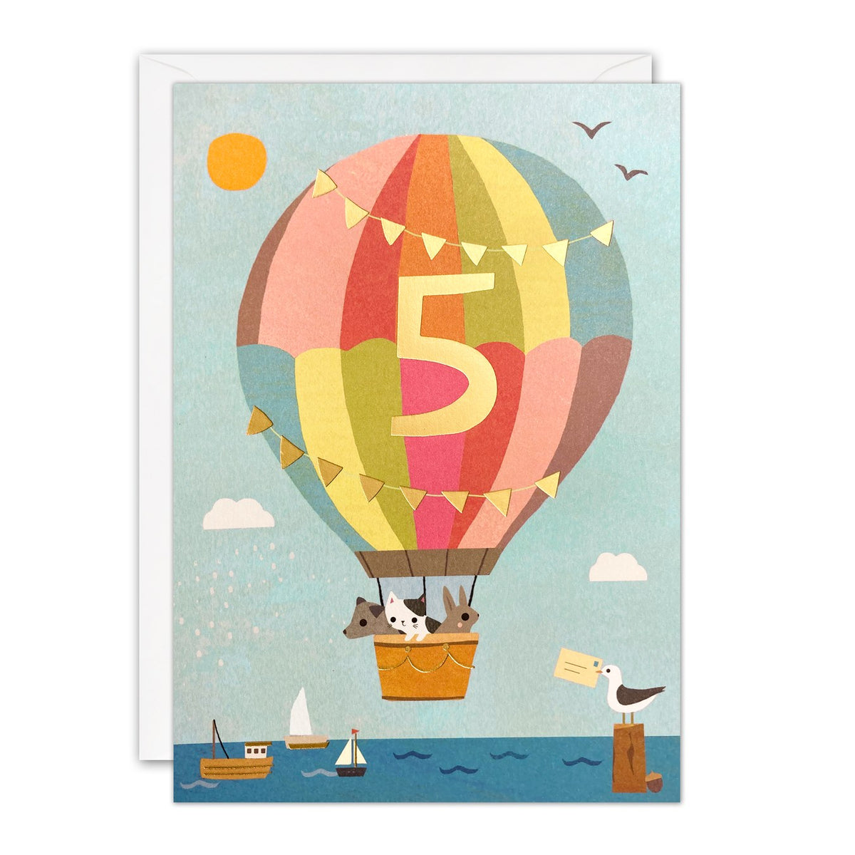 5th birthday card with a pastel rainbow hot air balloon, gold foil number 5 and bunting, floating over the sea