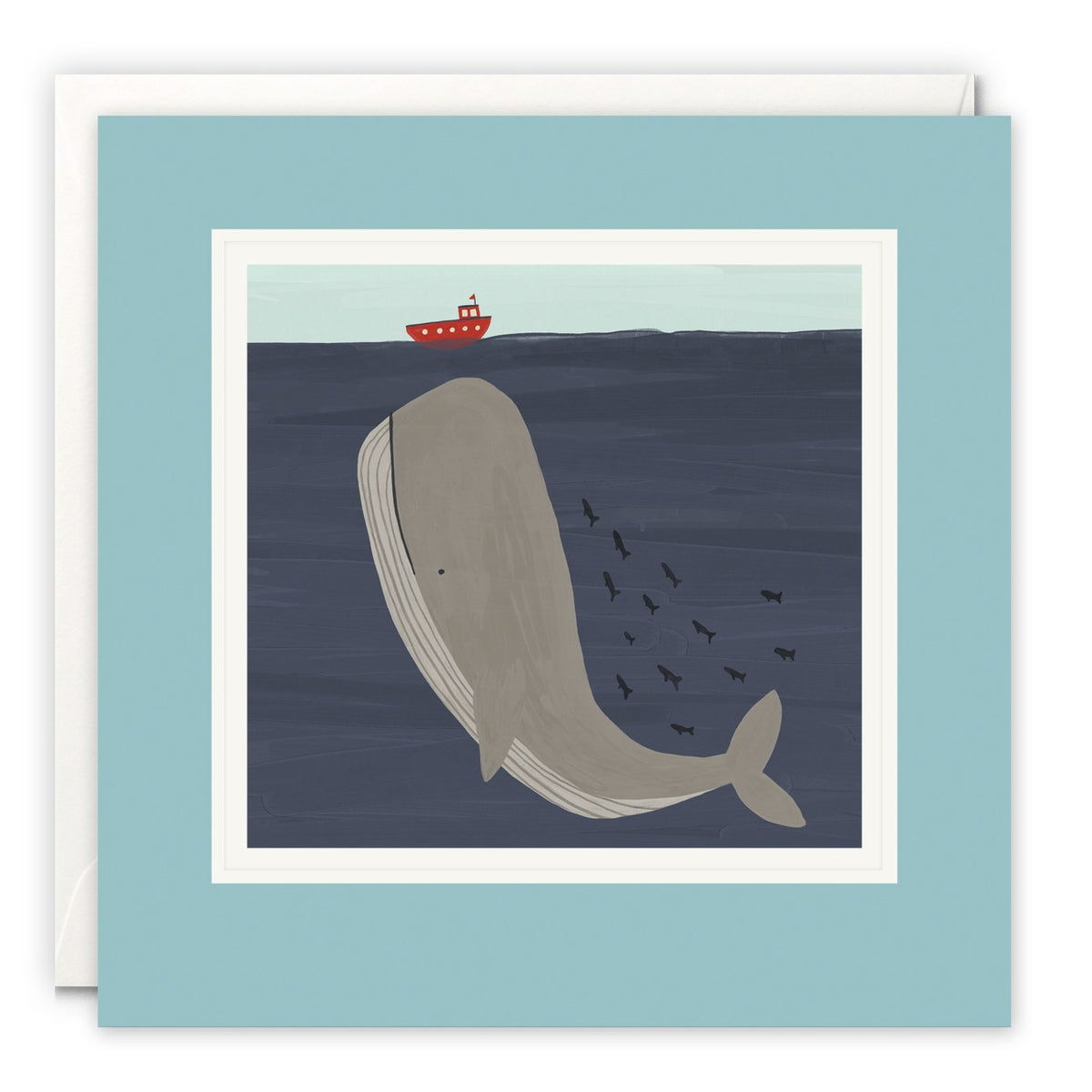 Large grey whale swimming in deep navy sea beneath a small red boat, with a shoal of fish