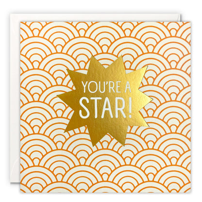Square card with You're a Star! on a gold foil starburst over an orange and cream Art Deco scallop pattern