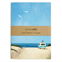 A6 notebook cover with a pale blue campervan on sand dunes facing the sea, a figure sitting on its roof