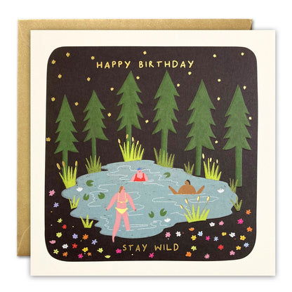 Square birthday card with swimmers in a forest pool under starry sky, gold foil 'Happy Birthday – Stay Wild'