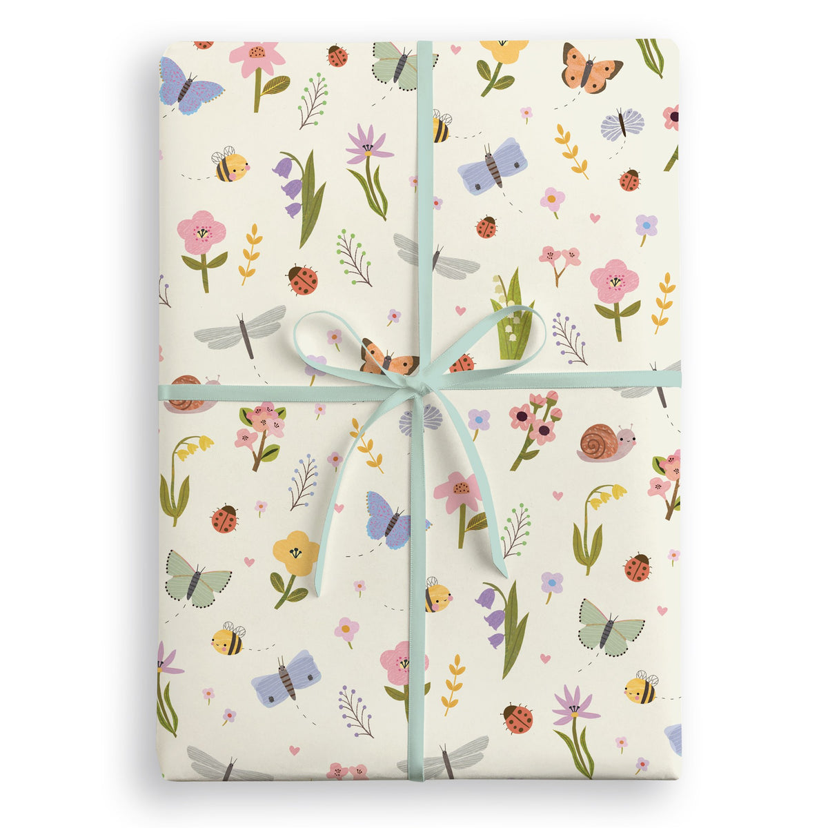 Cream wrapping paper with butterflies, bees, ladybirds and wild flowers, tied with a pale blue ribbon