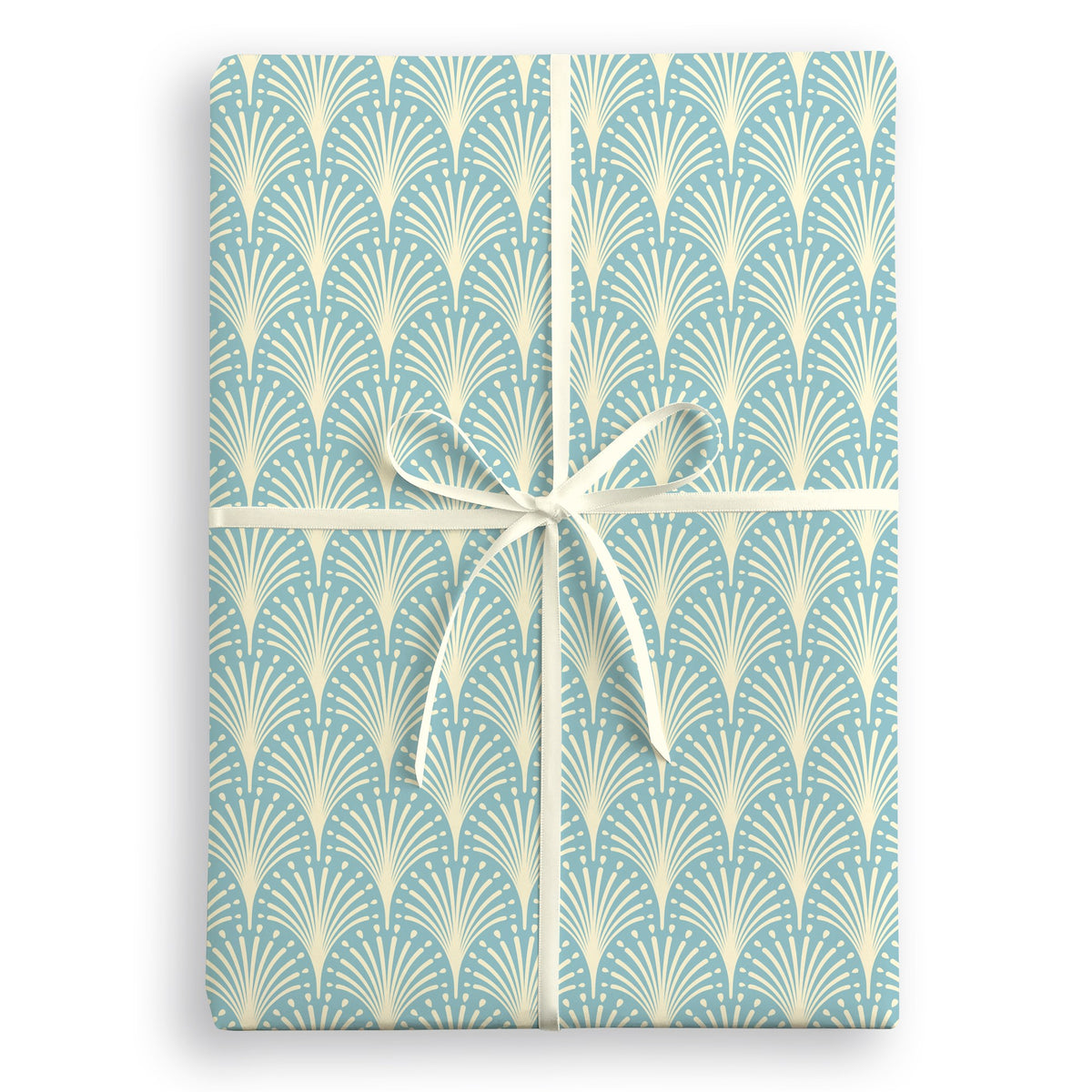 Duck-egg blue wrapping paper with a repeating cream Art Deco fan pattern, tied with a cream ribbon