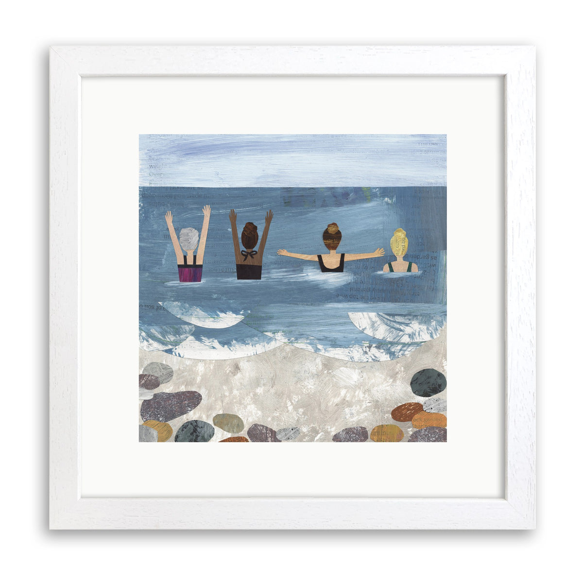 White wood framed print of four women swimmers with arms raised in the sea above a pebbly beach