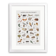 White wood framed print of woodland alphabet with badger, fox, owl and other woodland creatures