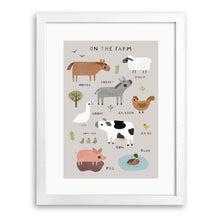 White wood framed print of labelled farm animals including a cow, pig, sheep and horse