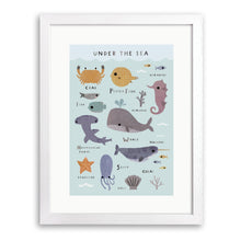 White wood framed print of labelled sea creatures including a whale, crab, seahorse and shark