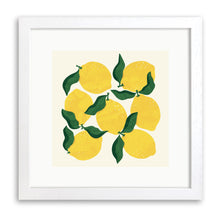 White wood framed print of yellow lemons with dark green leaves on a cream background